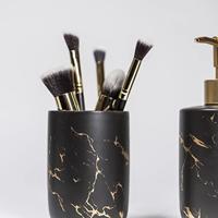 QUVIO Zeepdispenser + tandenborstelhouder - Zwart met goud - thumbnail