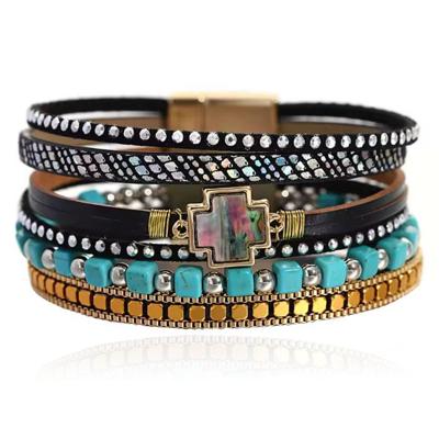Deja Boho Armband goudkleurig met turquoise kralen en kruis natuursteen in zwart met print