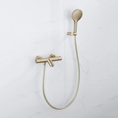 Fortifura Calvi Thermostatische badkraan met ronde handdouche, handdouchehouder en gladde doucheslang Geborsteld Messing PVD (Goud) SW799449/SW720567/SW720226/SW728177