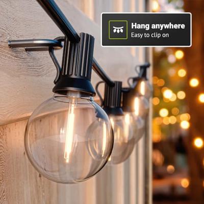 Solar Lichtsnoer 5m - G40 Filament lampen - 2700K Warm wit - IP44 Waterdicht - 4 Lichtmodi - 300 Lumen - Lichtslinger buiten Solar Lichtsnoer 5m - G40 Filament lampen - 2700K Warm wit - IP44 Waterdicht - 4 Lichtmodi - 300 Lumen - Lichtslinger buiten