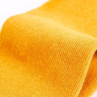 Kindermaillot 104 okerkleurig