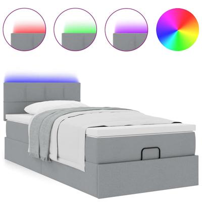 Ottoman bed met matras en LED's 120x190 cm stof lichtgrijs