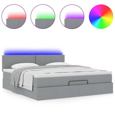 Ottoman bed met matras en LED's 120x200 cm stof lichtgrijs