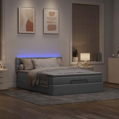 Ottoman bed met matras en LED's 140x200cm stof lichtgrijs