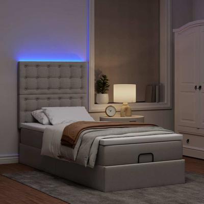 Ottoman bed met matras en LED's 80x200cm stof taupe