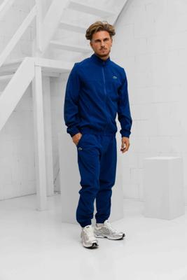 Lacoste Tennis x Novak Djokovic Trainingspak Heren Blauw - Maat M - Kleur: Blauw | Soccerfanshop