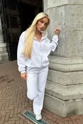 Unique The Label Joleen Full Zip Trainingspak Dames Lichtgrijs - Maat XS - Kleur: Lichtgrijs | Soccerfanshop