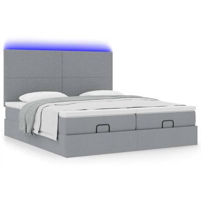 Ottoman bed met matrassen en LED's 160x200cm stof lichtgrijs