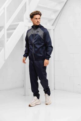 Cruyff Cambio Woven Trainingspak Heren Blauw - Maat S - Kleur: Donkerblauw | Soccerfanshop