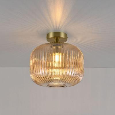 Plafondlamp Virello ambra - E27-fitting - Bol van geribbeld amberkleurig glas - Vulkaanvormige gouden drager - IP20 voor binnen Plafondlamp Virello ambra - E27-fitting - Bol van geribbeld amberkleurig glas - Vulkaanvormige gouden drager - IP20 voor binnen