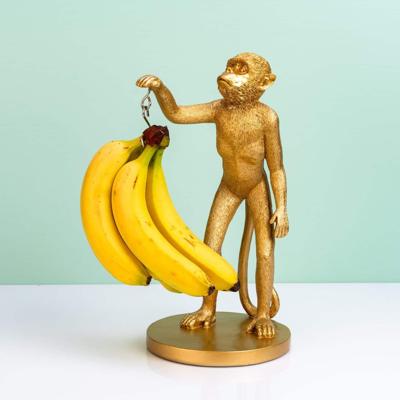 Aap banaanhouder - goud Aap banaanhouder - goud