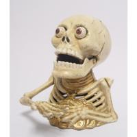 EEN GIETIJZEREN MECHANISCHE BANK MET SKELET - thumbnail