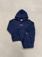 Cou7ure Essentials Rubber Trainingspak Kids Donkerblauw - Maat 140 - Kleur: Donkerblauw | Soccerfanshop - thumbnail