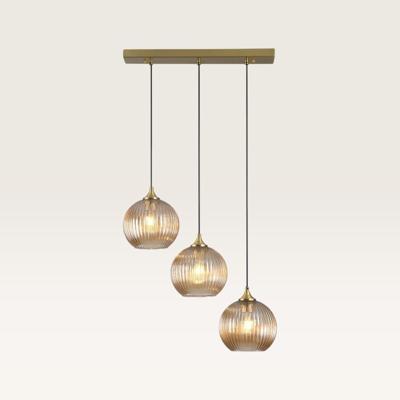 Hanglamp Globo ambra III - Drie bollen van geribbeld amberkleurig glas in verschillende vormen, met een speels effect - Zonder lichtbron