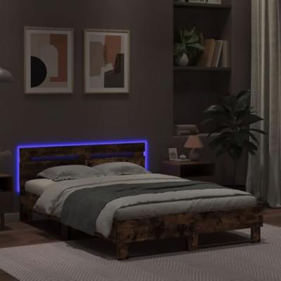 Bedframe met hoofdeinde en LED gerookt eikenkleurig 135x190 cm