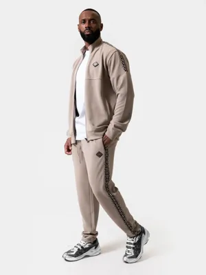 XPLCT Creator Trainingspak Heren Beige - Maat M - Kleur: Beige | Soccerfanshop