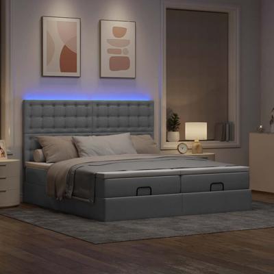 Ottoman bed met matrassen en LED's 180x200cm stof lichtgrijs