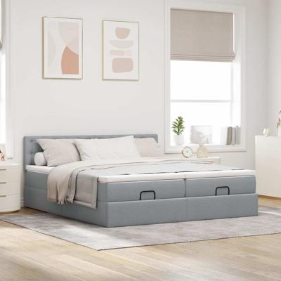 Ottoman bed met matrassen en LED's 180x200cm stof lichtgrijs
