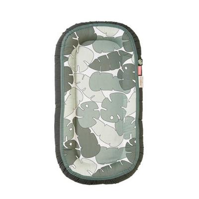 Done by Deer Cosy babynest Plus Tiny tropics Green