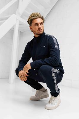 XPLCT X SFS Creative Trainingspak Heren Donkerblauw - Maat S - Kleur: DonkerblauwWit | Soccerfanshop