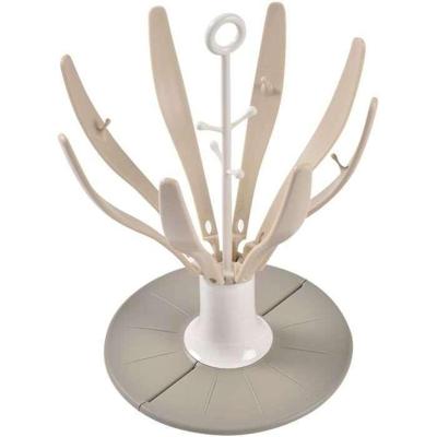 Opvouwbaar flessendroogrek in bloemvorm - BEABA - Geschikt voor maximaal 8 flessen - Klei Opvouwbaar flessendroogrek in bloemvorm - BEABA - Geschikt voor maximaal 8 flessen - Klei