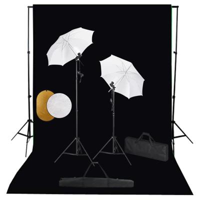 Fotostudioset met lampen, paraplu's, achtergrond en reflector