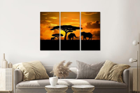 Schilderij - Olifanten familie bij zonsondergang, 120x80cm, 3 luik, premium print - thumbnail