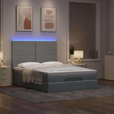 Ottoman bed met matras en LED's 140x200cm stof lichtgrijs