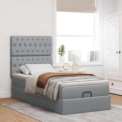Ottoman bed met matras en LED's 140x200cm stof lichtgrijs