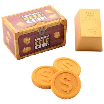 John Toy Groeiende munt in goudstaaf