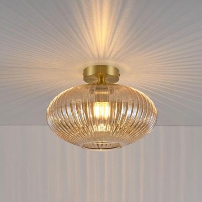 Plafondlamp Ovale ambra - E27-fitting - Bol van geribbeld amberkleurig glas - Vulkaanvormige gouden drager - IP20 voor binnen Plafondlamp Ovale ambra - E27-fitting - Bol van geribbeld amberkleurig glas - Vulkaanvormige gouden drager - IP20 voor binnen