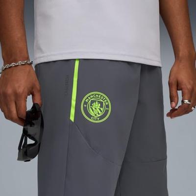 PUMA Manchester City Pumatech Trainingsbroek Woven 2025-2026 Grijs Groen PUMA Manchester City Pumatech Trainingsbroek Woven 2025-2026 Grijs Groen