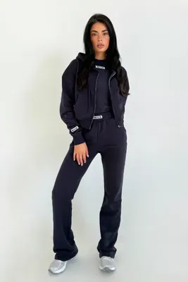 Unique The Label Molly Trainingspak Dames Donkerblauw - Maat M - Kleur: Donkerblauw | Soccerfanshop