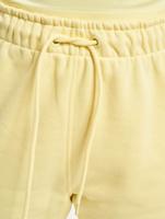 Karl Kani / joggingbroek Signature in geel - thumbnail