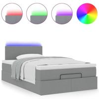 Ottoman bed met matras en LED's 120x200 cm stof lichtgrijs - thumbnail