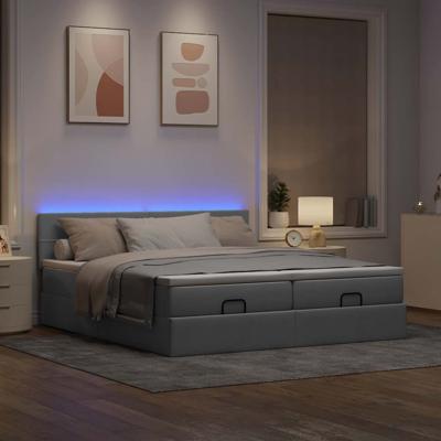 Ottoman bed met matrassen en LED's 180x200cm stof lichtgrijs