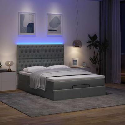 Ottoman bed met matras en LED's 140x190cm stof donkergrijs