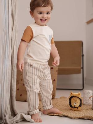 Gestreepte babybroek in linnen look ecru Gestreepte babybroek in linnen look ecru