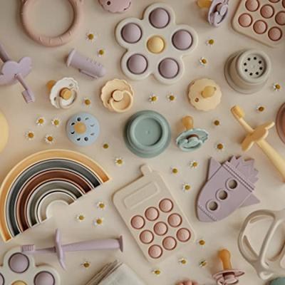 Pop-it telefoon - MUSHIE rozen Pop-it telefoon - MUSHIE rozen