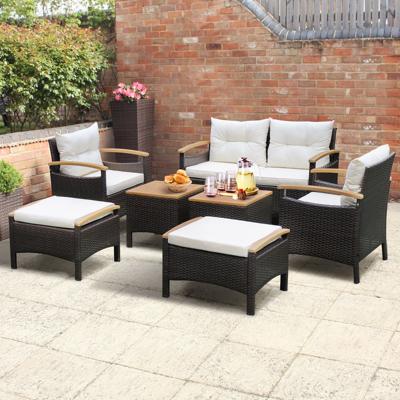 7-Delige Rotan Tuinset PE Buitenmeubelset met 1 Loveseat 2 Fauteuils 2 Poefs 2 Salontafels Acaciahouten Blad Kussens voor Patio Binnenplaats