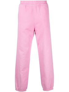 Stüssy pantalon de jogging en coton à logo brodé - Rose