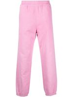 Stüssy pantalon de jogging en coton à logo brodé - Rose