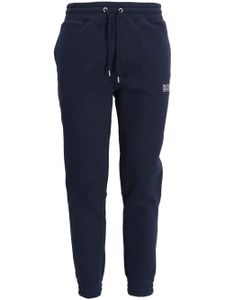 BOSS pantalon de jogging fuselé à logo imprimé - Bleu