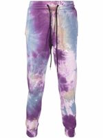 Mauna Kea pantalon de jogging fuselé à imprimé tie dye - Violet
