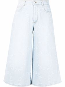 Stella McCartney jupe-culotte en jean effet-usé à logo Stella - Bleu