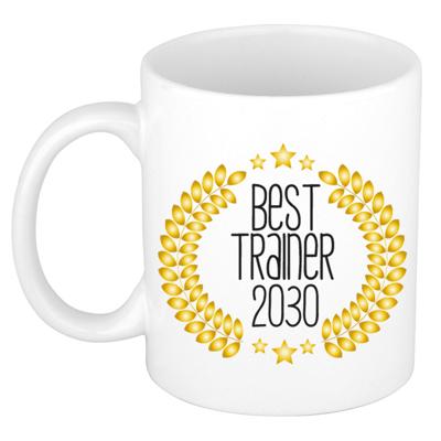 Cadeau koffie/thee mok - de beste trainer van 2030 - wit - 300 ml - keramiek