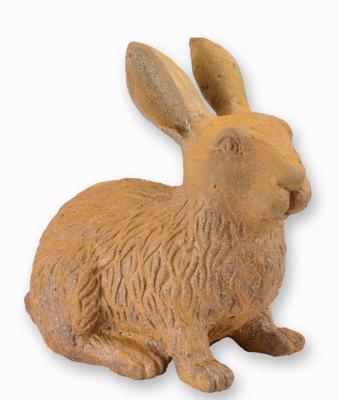 A RUSTY CAST IRON FIGURINE OF A RABBIT