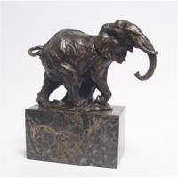 A BRONZE SCULPTURE OF A WALKING ELEPHANT