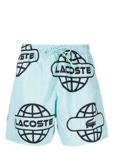 Lacoste short de bain à imprimé Globe - Vert