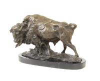 A BRONZE SCULPTURE OF A BUFFALO